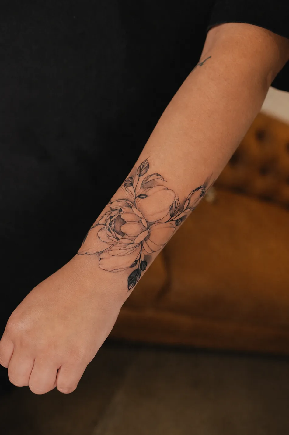 Fine line floral tattoo by Christian Cruz